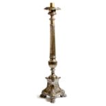 An 18th century Italian silvered brass altar candlestick, the urn shape top above a fluted and