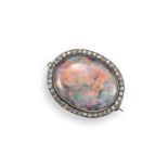 An early 20th century opal and diamond brooch, the solid white oval opal cabochon is set within a