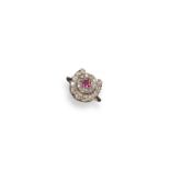 A ruby and diamond cluster ring, centred with a circular-cut ruby set within a surround of rose-