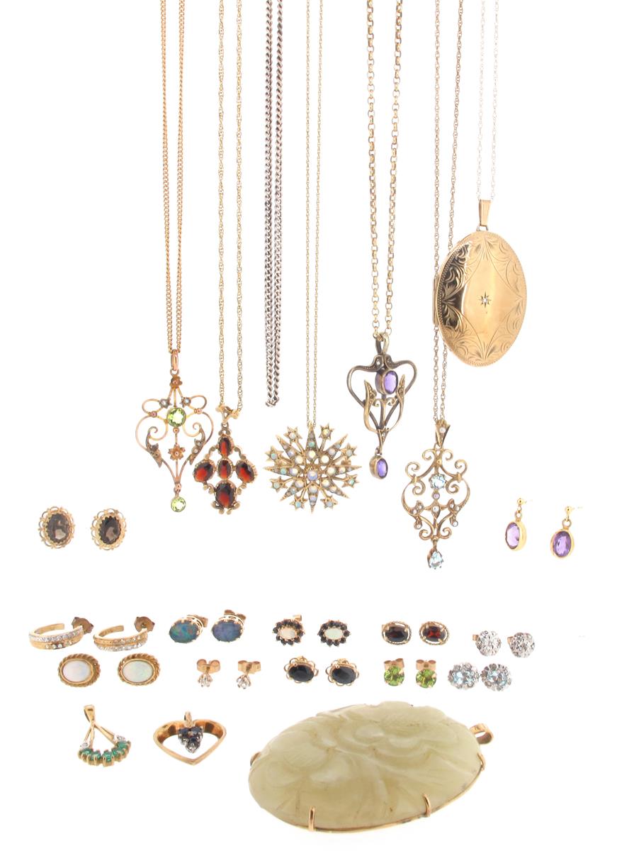 A gold locket pendant, on a fine link gold neck chain, with eight other gold pendants, and a