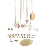 A gold locket pendant, on a fine link gold neck chain, with eight other gold pendants, and a