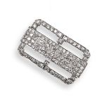 An Art Deco diamond brooch, pave-set with circular-cut diamonds in platinum. 3.2cm long.