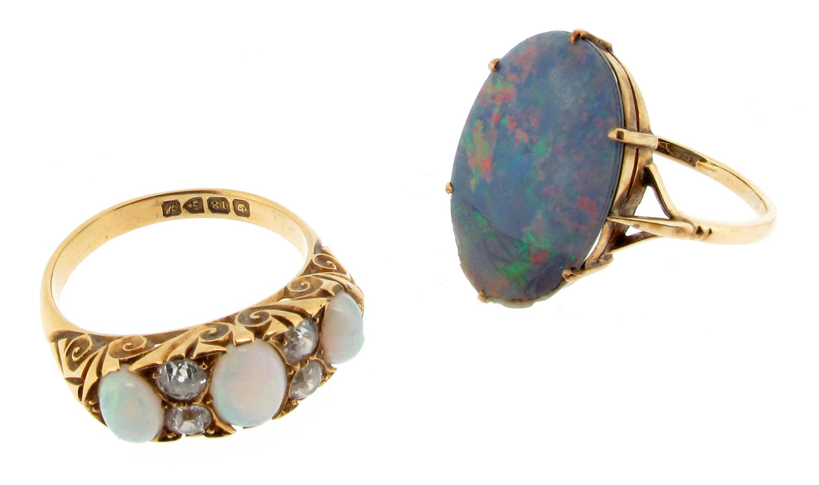 An opal and diamond half hoop ring, set with four old cushion-shaped diamonds and three graduated