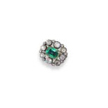 A Victorian Emerald and diamond cluster brooch, the emerald set within a surround of graduated