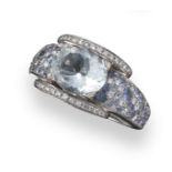 An aquamarine, diamond and sapphire set white gold cluster ring by Mauboussin, centred with an