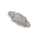 A diamond-set platinum double clip foliate brooch, set overall with graduated circular-cut diamonds.