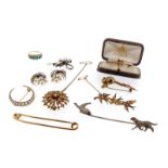 A 9ct gold doormouse brooch. An Edwardian seed pearl-set gold closed crescent brooch. A gold fox
