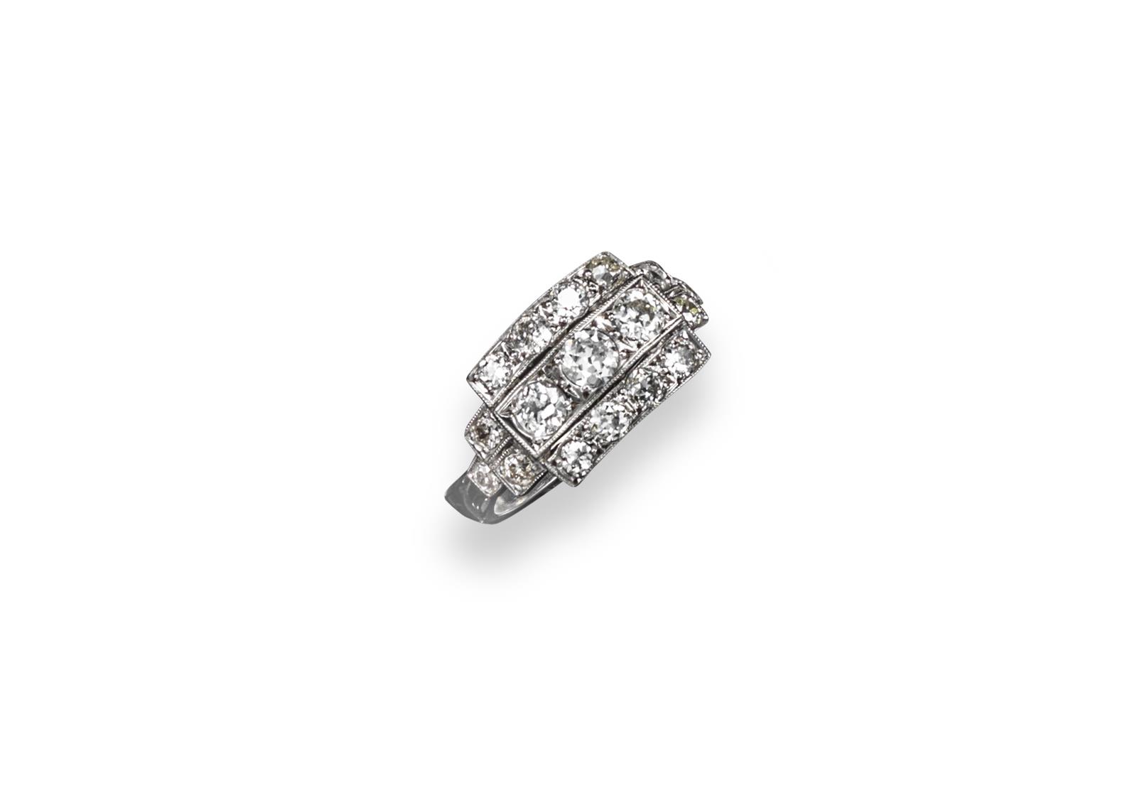 A diamond cluster ring, the circular-cut diamonds weigh approximately 1.25cts in total and are