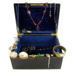 A wooden jewellery casket with two lift-out fitted trays, the jewellery includes a gold fine link