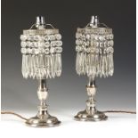 A pair of Victorian silver plated lustre table lamps, later converted with cut glass drops and