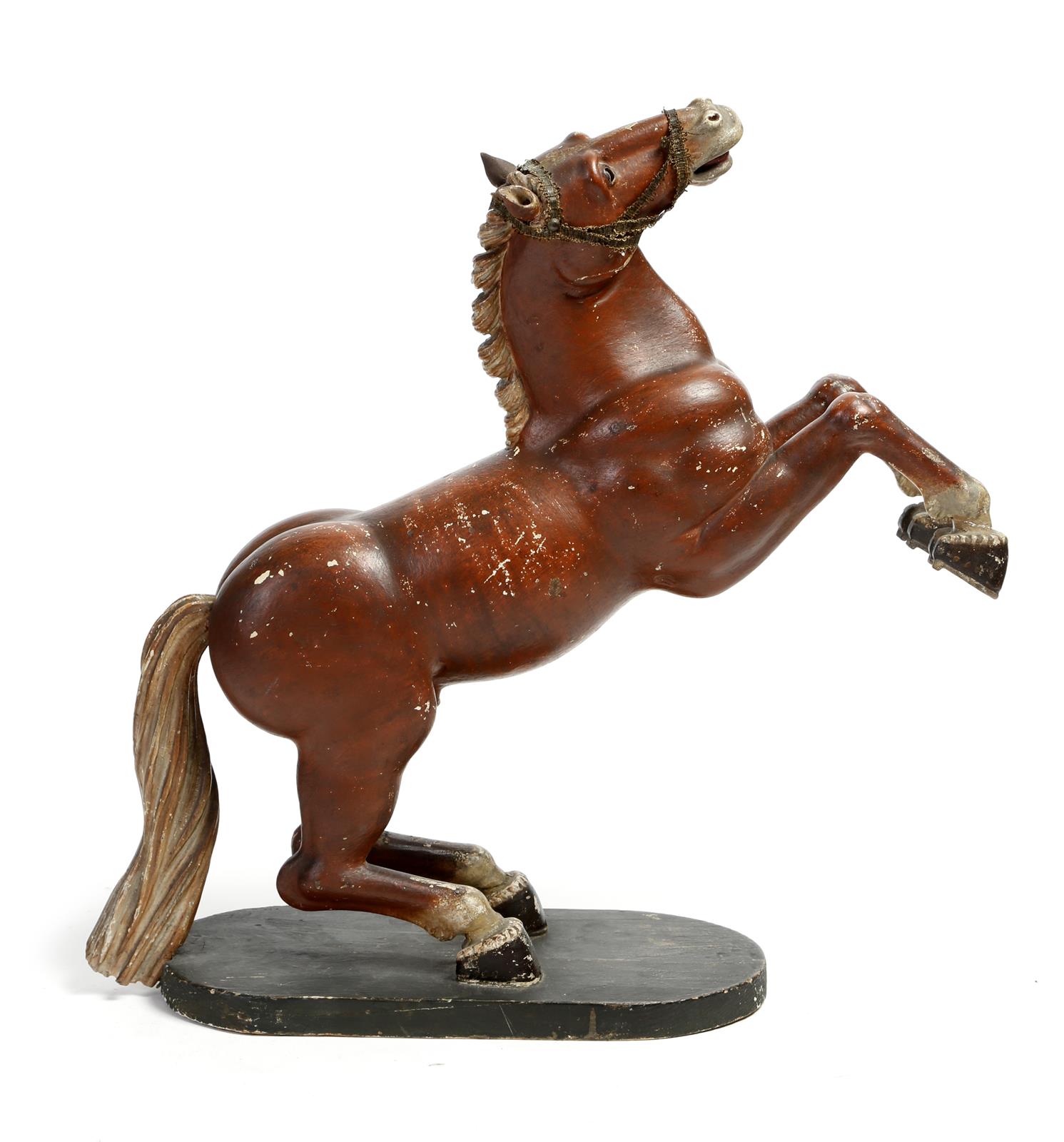 A late Victorian folk art carved and painted wood model of a rearing horse, with glass eyes, 43.