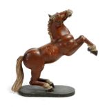 A late Victorian folk art carved and painted wood model of a rearing horse, with glass eyes, 43.