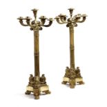 A pair of 19th century gilt bronze seven-light candelabra, each with fluted scroll arms and