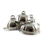 A set of four Victorian electroplated meat dish covers, unmarked, domed lobed oval form,