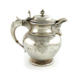 λA late-Victorian regimental silver ewer, by Gibson and Langman, London 1898, baluster form, the