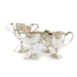 A collection of three regimental silver trophy cups, comprising: 'The Banbury Cup', Sheffield