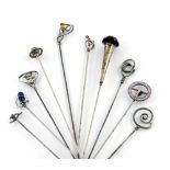 A collection of ten Charles Horner silver hat pins, comprising: one of buckle form, Chester 1912,