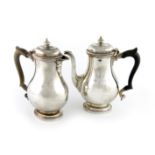 A pair of regimental silver café au lait pots, by Henry Atkins, Sheffield 1936, oval baluster