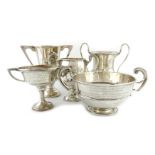 A mixed lot of regimental silver trophy cups, comprising: a two-handled trophy bowl, London 1905,