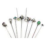 A collection of ten Edwardian silver Charles Horner hat pins, comprising: one with a butterfly