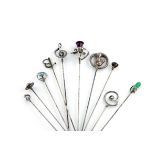 A collection of ten Charles Horner silver hat pins, comprising: one with a ladybird finial under
