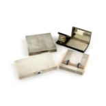 A small collection of four Art Deco silver compacts and cigarette case, comprising: a French gem set