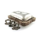 A set of four George III Regimental silver entrée dish bases, three covers and three handles,
