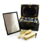 λA Victorian silver-gilt travelling dressing table set, by John Harris, London 1853, retailed by F.