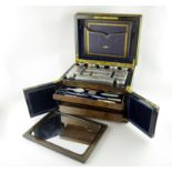 A Victorian silver travelling dressing table set, by Thomas Johnson, London 1865, retailed by H.