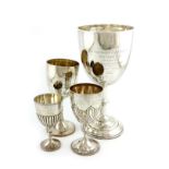 A collection of four regimental silver trophy goblets, comprising a large one: 'The Upton Cup',
