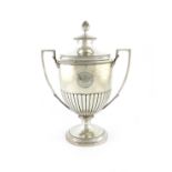 A George III silver two-handled trophy cup and cover, by William Frisbee, London 1805, urn form,