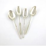 A collection of four George II and George III silver marrow spoons, comprising: a George II one,