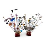 λA large collection of hat pins, various materials, including: one enamelled with an owl on a purple