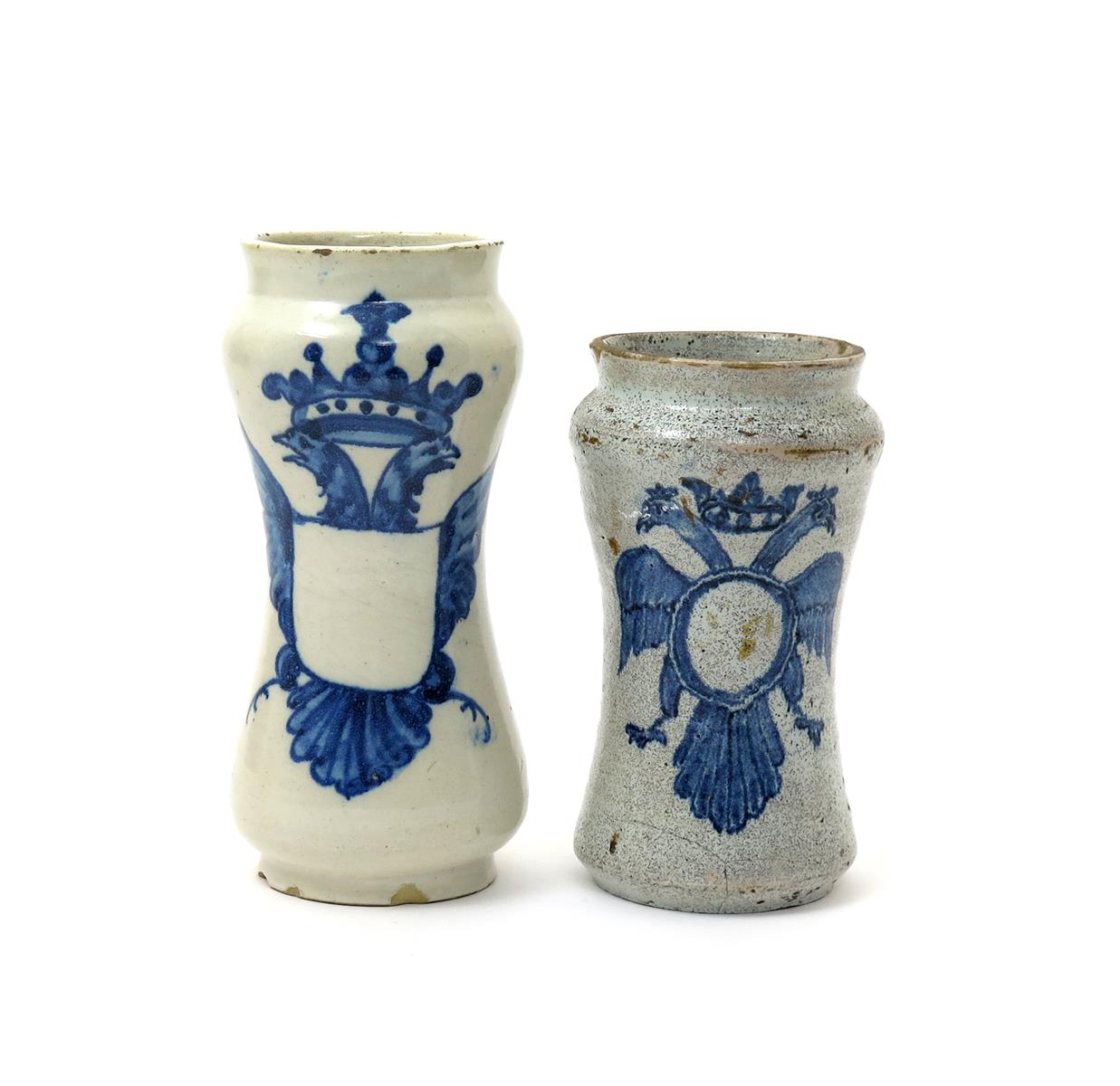 Two Talavera albarelli, c.1760, each waisted form painted in blue with an armorial device derived