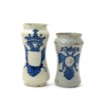 Two Talavera albarelli, c.1760, each waisted form painted in blue with an armorial device derived