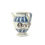 An Italian maiolica syrup or wet drug jar, c.1700, the ovoid body with straight spout and wide strap