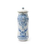 A Spanish faïence albarello and cover, dated 1773, probably Talavera, painted in blue with a