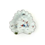 A Longton Hall leaf dish, c.1755-60, the overlapping leaves painted in the Kakiemon palette with the