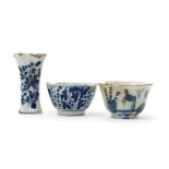 Two Delft small teabowls, 18th century, one painted with a Chinese figure crossing a bridge, with