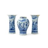 A Delft three vase garniture, 18th century, comprising a baluster vase and two flared sleeve