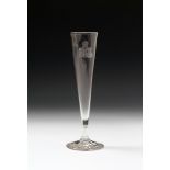A tall glass flute, 1st half 19th century, the slender drawn bowl engraved with a portrait of the