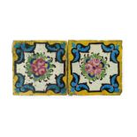 Two Qajar pottery tiles, late 19th century, painted with a stylized arrangement of pink roses within