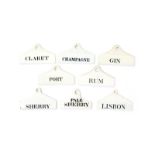 Eight creamware bin labels, 1st half 19th century, most Wedgwood, of coathanger form, ariously