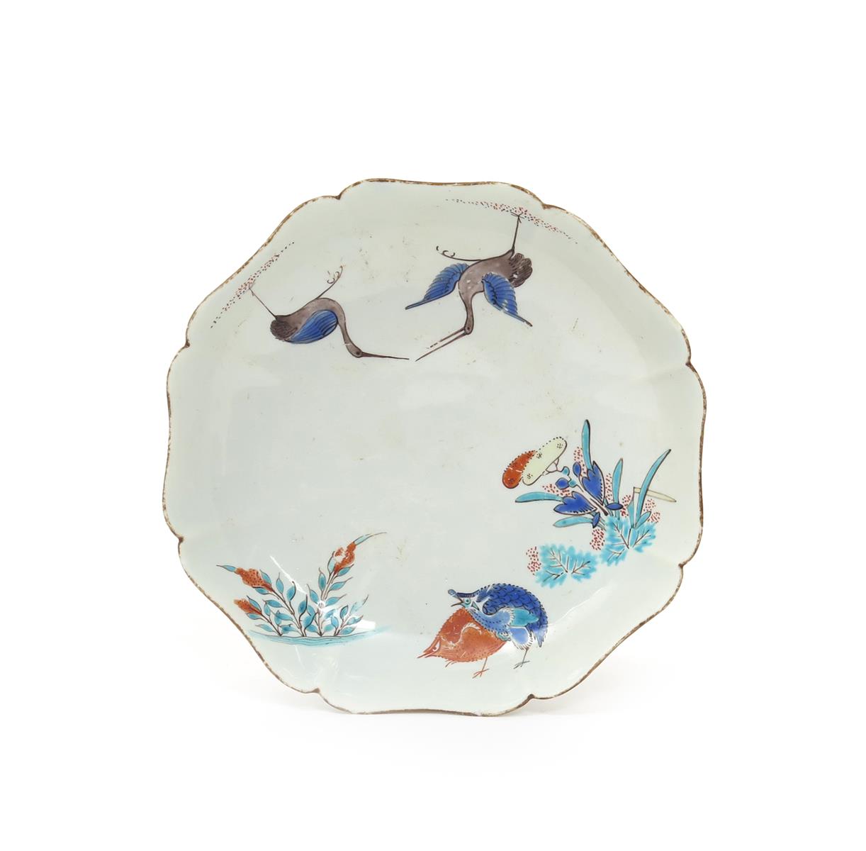 A Chantilly lobed saucer, c.1730-35, painted in the Kakiemon palette with a version of the Two Quail