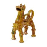 A Canakkale (Turkey) pottery model of a lion, c.1900, standing four square with mouth agape, its