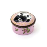 An English enamel snuff box or bonbonnière, c,1760-70, of circular form, the lid moulded with a