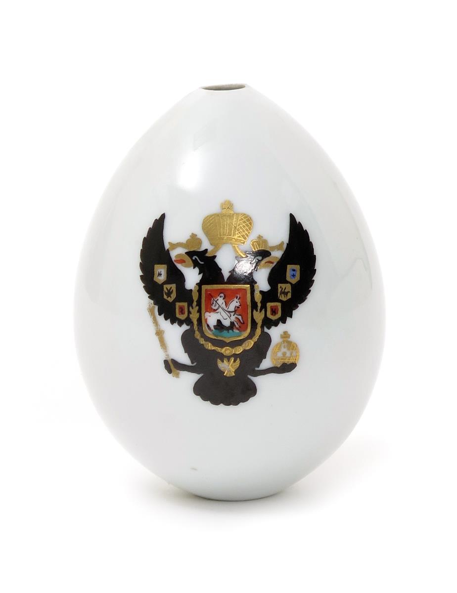 A large Russian porcelain presentation egg, 19th/20th century, painted with a version of the Russian