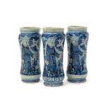 Three Italian maiolica albarelli, c.1700, the slender waisted forms painted in blue and black with