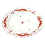 A large Chelsea serving dish, c.1752, the rim painted in the Kakiemon manner with four iron red