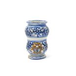 A Deruta maiolica small albarello or pill jar, c.1700, the waisted body with a blank cartouche